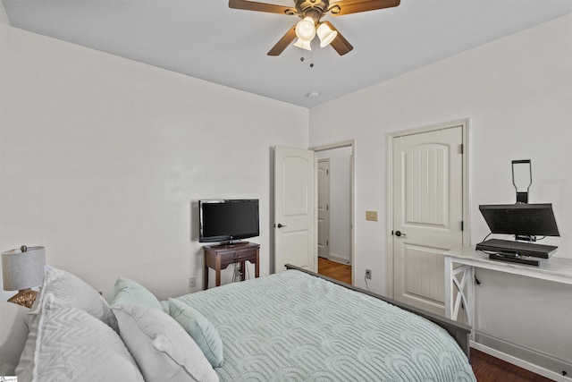 bedroom featuring ceiling fan and dark wood-type flooring