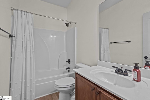 full bathroom with shower / bath combo with shower curtain, vanity, hardwood / wood-style floors, and toilet