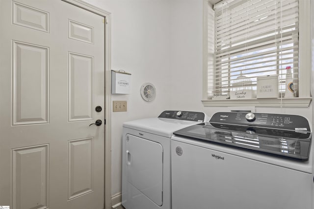 laundry area with washing machine and clothes dryer