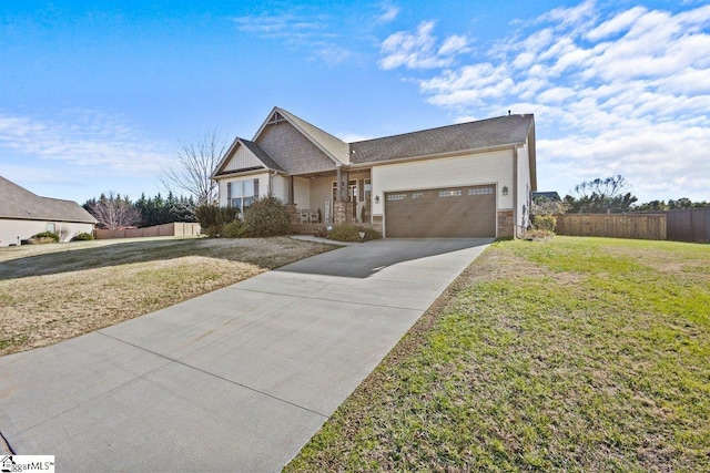 view of front of home with a garage and a front yard