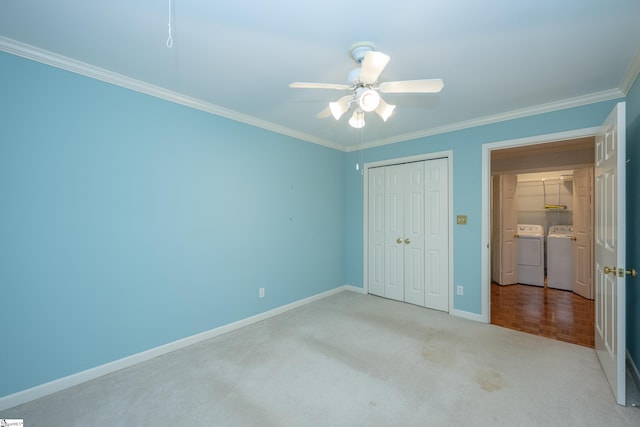 unfurnished bedroom featuring ceiling fan, a closet, crown molding, and independent washer and dryer