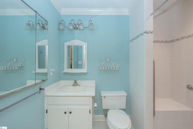 bathroom with tiled shower, vanity, toilet, and ornamental molding