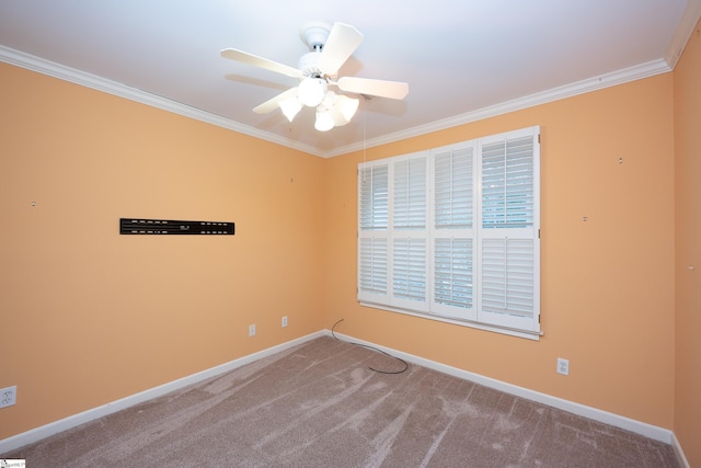 carpeted spare room with ceiling fan and ornamental molding