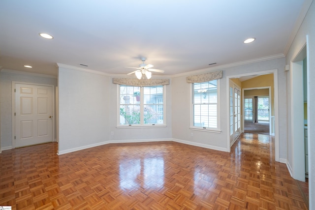 spare room featuring ceiling fan, dark parquet floors, and crown molding