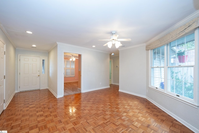 spare room with ceiling fan, light parquet flooring, and ornamental molding