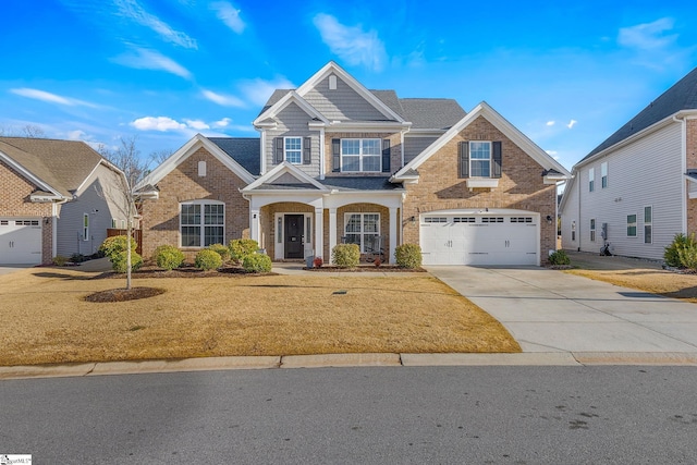 view of front of property with a garage and a front lawn