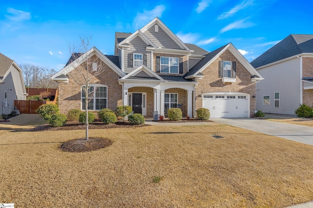 view of front of property featuring a garage and a front lawn