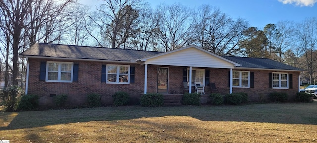 ranch-style house featuring a porch and a front yard