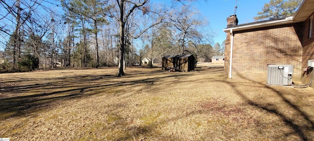 view of yard featuring central AC