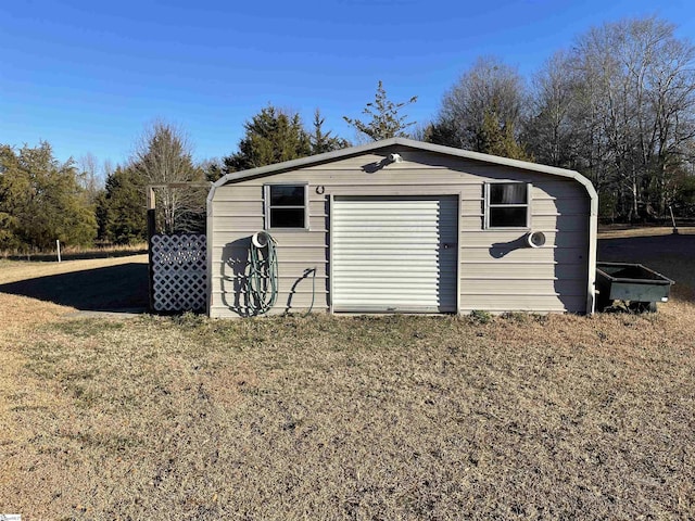 view of outdoor structure with a garage