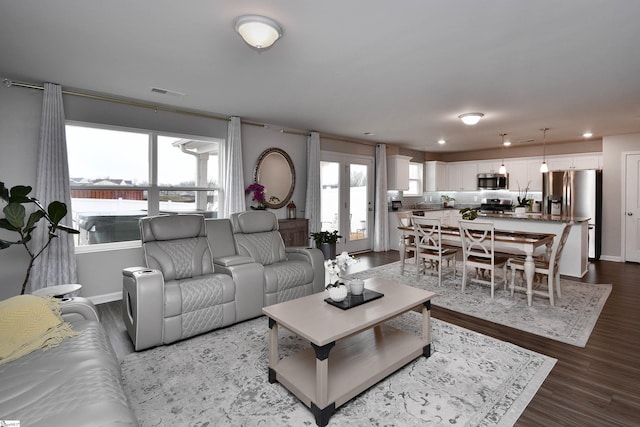 living room featuring french doors and hardwood / wood-style flooring