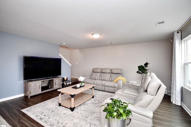 living room featuring dark hardwood / wood-style flooring