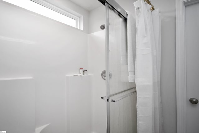 bathroom with a shower with shower curtain