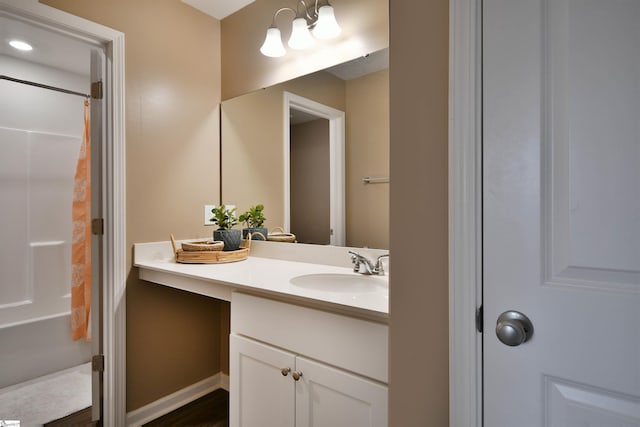 bathroom with a shower with shower curtain and vanity