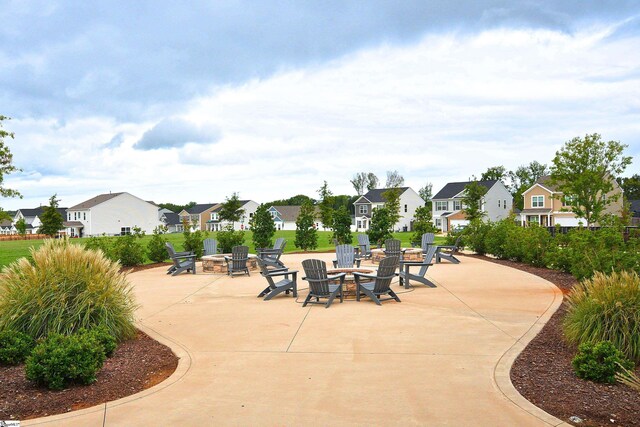 view of patio / terrace featuring an outdoor fire pit