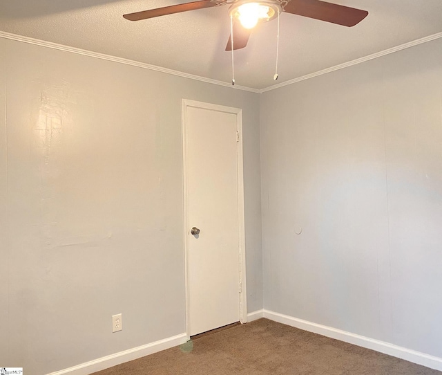 unfurnished room featuring ceiling fan, carpet, and ornamental molding