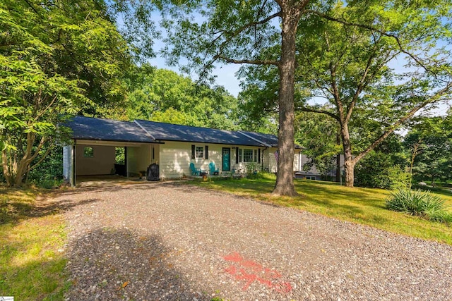 ranch-style house with a carport and a front yard