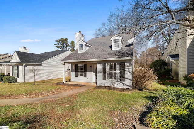 cape cod-style house with a front yard and a porch