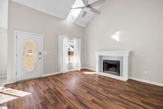 unfurnished living room featuring ceiling fan, high vaulted ceiling, and dark wood-type flooring