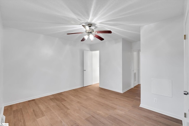 unfurnished room featuring ceiling fan and light wood-type flooring