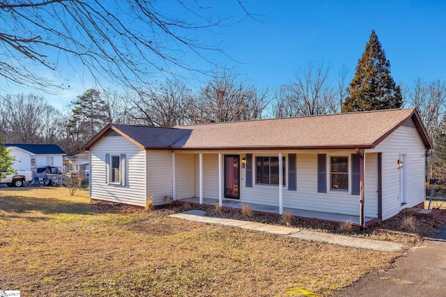 ranch-style house featuring a front yard and a porch