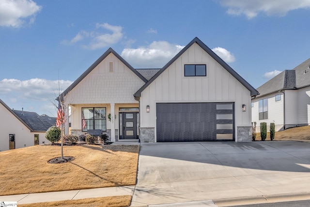 modern farmhouse style home featuring a front yard, a porch, and a garage