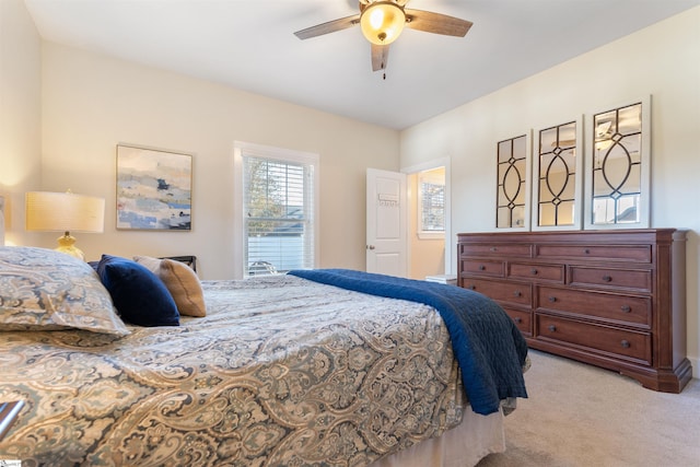 bedroom featuring ceiling fan and light colored carpet