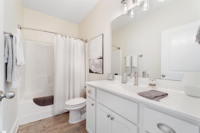 full bathroom featuring toilet, vanity, shower / bath combination with curtain, and hardwood / wood-style flooring