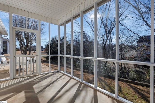 unfurnished sunroom featuring plenty of natural light