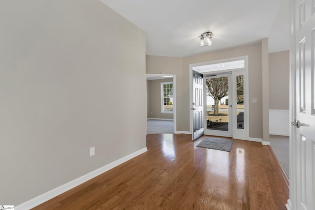 entryway with hardwood / wood-style flooring