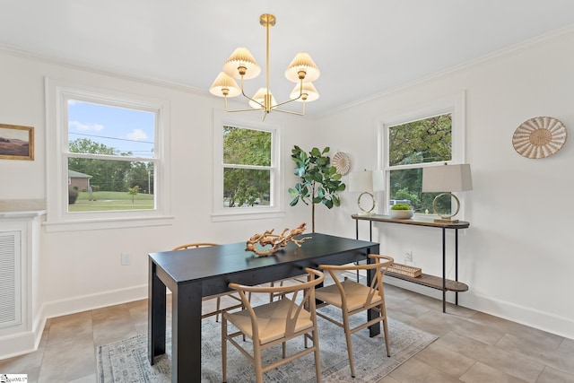 tiled dining room featuring a chandelier and crown molding