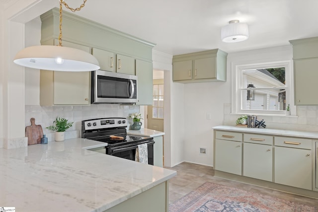 kitchen with appliances with stainless steel finishes, tasteful backsplash, light stone counters, and green cabinetry