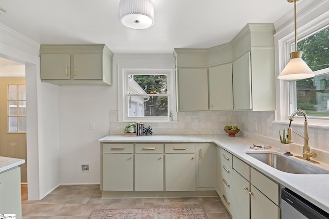 kitchen with sink, hanging light fixtures, stainless steel dishwasher, decorative backsplash, and ornamental molding