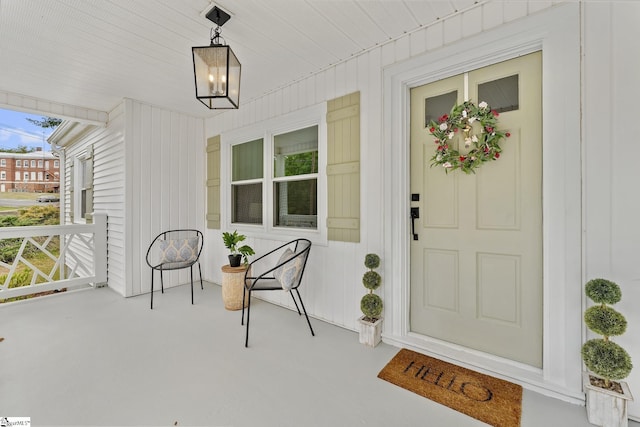 doorway to property with a porch