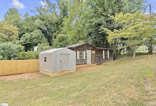 view of outbuilding with a lawn