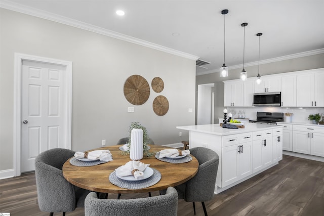 interior space with dark hardwood / wood-style flooring and ornamental molding