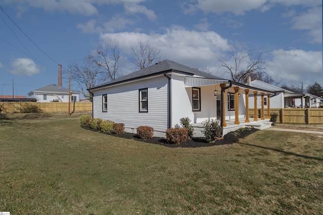 view of property exterior featuring a yard and a porch