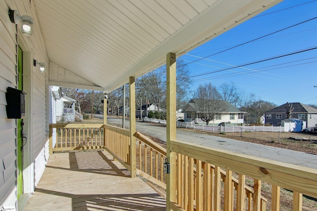 wooden terrace featuring covered porch