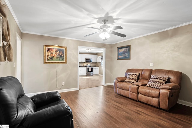 living room with ceiling fan, dark wood-type flooring, and ornamental molding