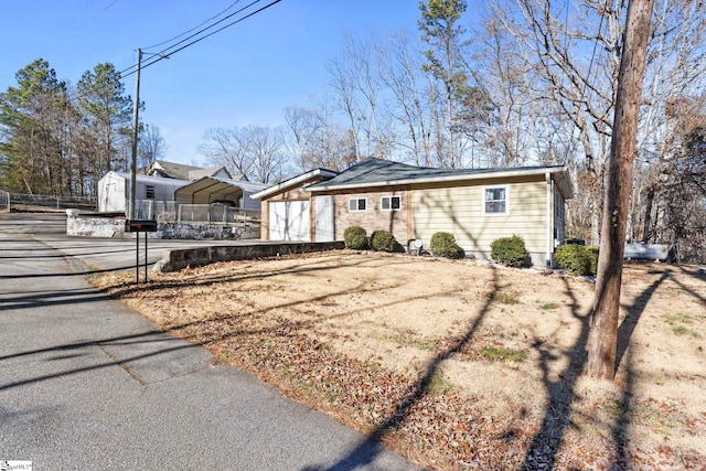 single story home featuring a carport