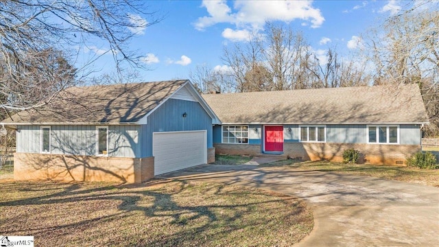 view of front of house with a front yard and a garage