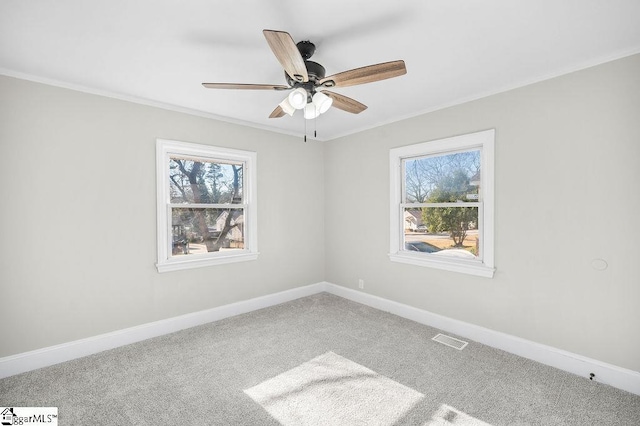 carpeted empty room featuring ceiling fan