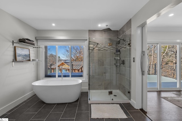 bathroom featuring separate shower and tub and tile patterned flooring