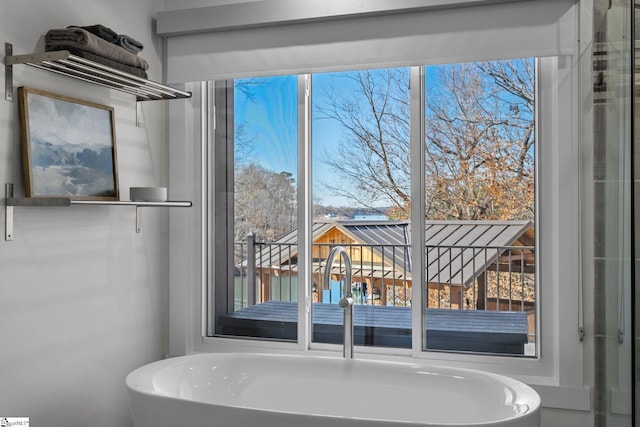 bathroom featuring a bathing tub and sink