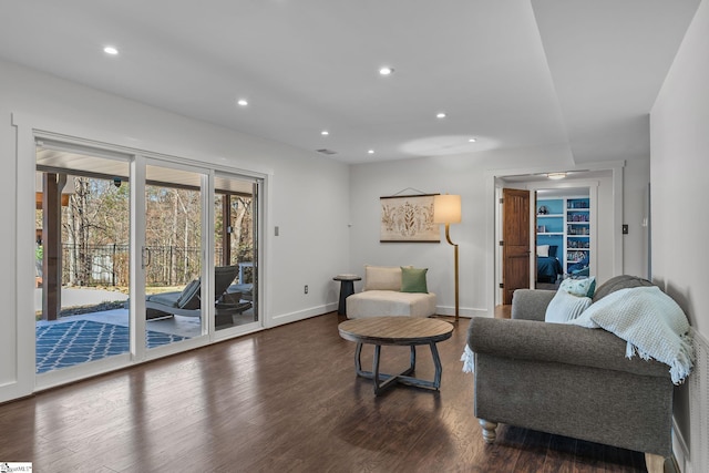 living room with dark hardwood / wood-style floors