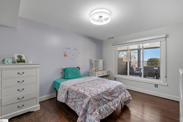 bedroom featuring dark hardwood / wood-style flooring