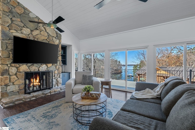 living room featuring a fireplace, a healthy amount of sunlight, and wood ceiling