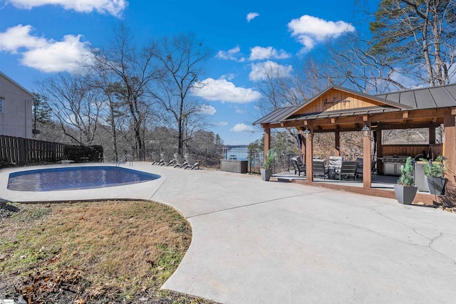 view of swimming pool featuring a patio area