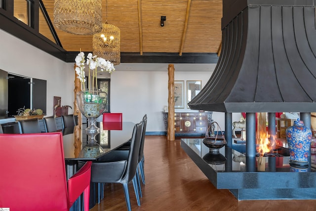 dining area featuring wood ceiling, lofted ceiling, dark hardwood / wood-style floors, and a chandelier