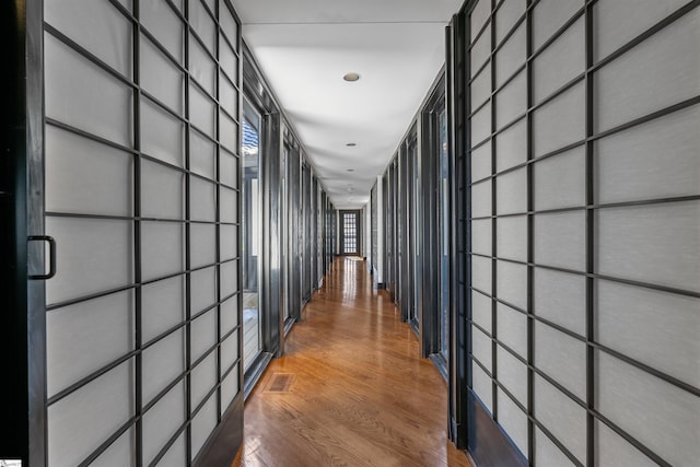 hallway featuring hardwood / wood-style floors and a package area